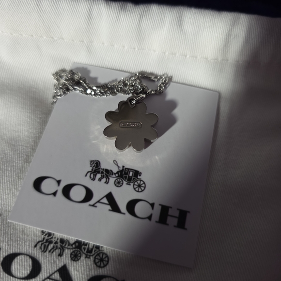 Coach Jewelry - COACH Silver And Orange Daisy Pendant Necklace